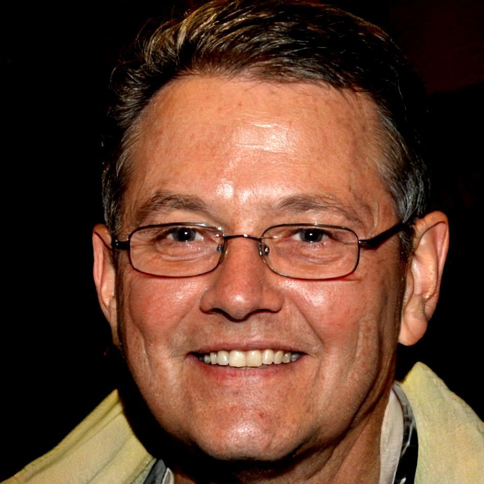 Professional headshot of Dmitri Kowalski, network operations specialist